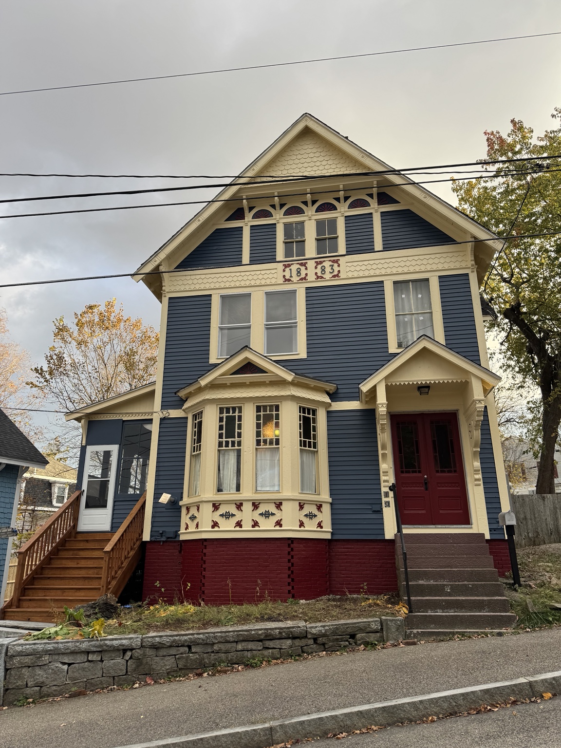 Exterior painting project with detailed porch trim by Do Carmo’s Painting & Services
